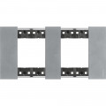 Plaque de finition Living Now Collection Les Blancs matière zamak 2x2 modules - finition Acier Moon